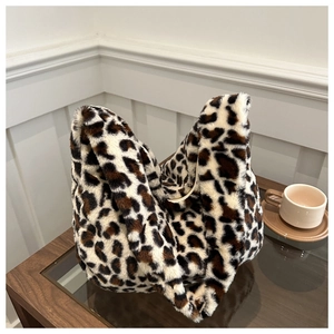Detail of soft leopard print faux fur shoulder bag with plush texture for winter style