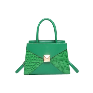 Emerald green crossbody tote featuring faux crocodile texture and gold square buckle