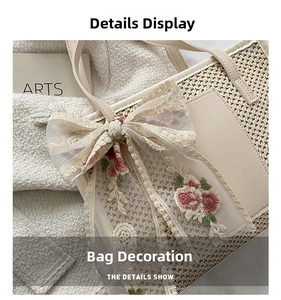 Detail of beige straw tote bag with mesh bow and floral embroidery in French style