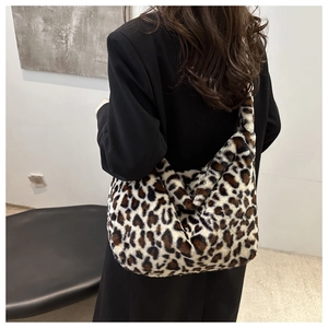 Detail of soft leopard print faux fur tote bag showing texture and oversized shoulder fit