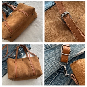 Detail view of brown suede tote bag featuring reinforced stitching and retro metal hardware