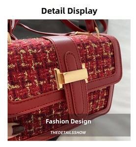 Detail of red and yellow tweed texture with golden buckle and leather trim on handbag