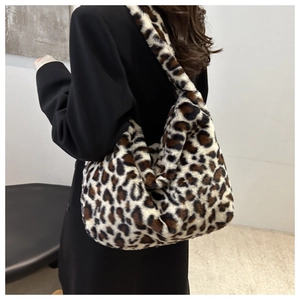 Detail of trendy leopard print plush tote bag with soft texture and spacious interior