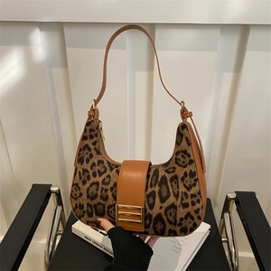 Retro leopard print crescent bag with brown leather trim and golden buckle closure
