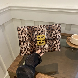 Chic leopard print envelope clutch with gold buckle and textured suede finish
