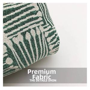 Macro shot of green and beige jacquard woven fabric showing detailed textile texture