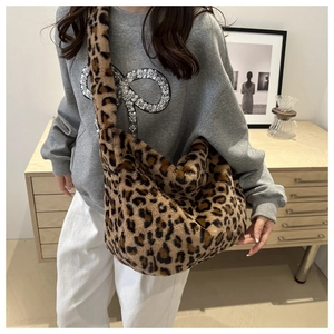 Close-up of leopard print plush shoulder bag with soft faux fur texture and large capacity