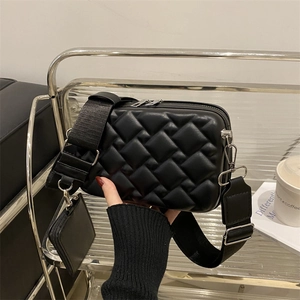 Quilted black crossbody box bag with wide shoulder strap and a mini pouch attached