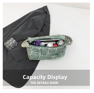 Detailed interior of green checkered tote bag showing high capacity for cosmetics