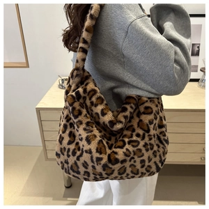 Detail of soft leopard print plush tote bag showing spacious capacity and furry texture
