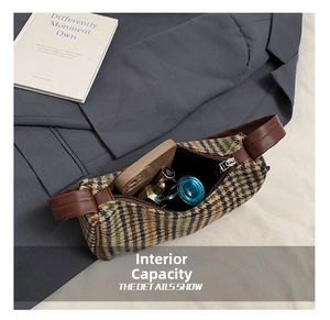 Interior view of houndstooth shoulder bag showing capacity for phone and cosmetics