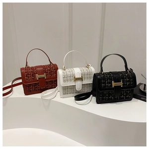 Three colors of tweed crossbody bags with golden H-buckle on white pedestals