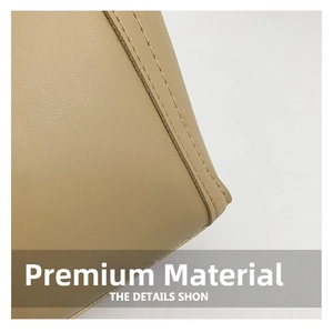 Close-up of light brown leather tote bag showing high-quality double stitching and fine texture