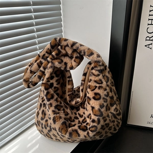 Chic leopard print faux fur hobo shoulder bag with a knotted handle and zipper closure