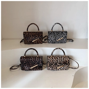 Fashionable leopard print handbags in four colors with metal locks and adjustable straps