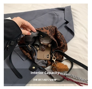 Detailed interior view of a leopard print tote bag showing spacious capacity for essentials
