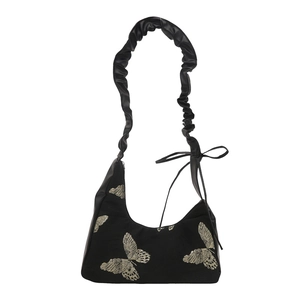 Retro black hobo bag with butterfly print and ruched shoulder strap with bow detail