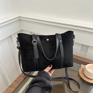 Retro black matte tote bag with leather handles and metallic studs for women