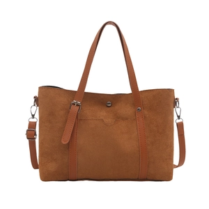 Brown suede minimalist tote bag with leather handles and metallic buckle accents