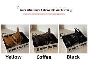 French style underarm bags in yellow, coffee, and black displayed in branded gift boxes