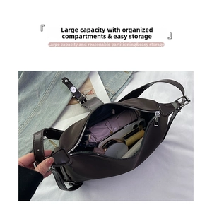 Top view of spacious dark brown shoulder bag interior showing large storage capacity
