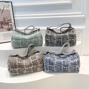 Striped knit hobo bags in four colors with textured patterns and zipper closure