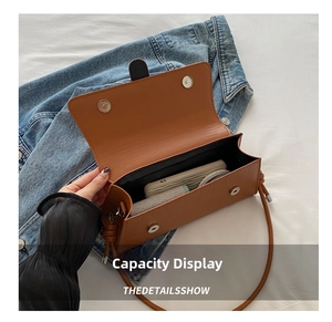 Top view of brown crocodile texture shoulder bag interior showing daily storage capacity