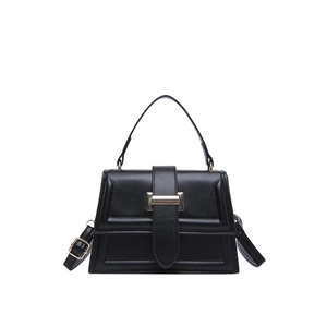 Elegant black trapezoid handbag with gold buckle and adjustable shoulder strap for women
