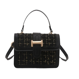 French style handbag with black leather and gold tweed pattern with a metal buckle
