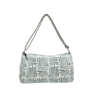 Green and white geometric patterned nylon tote bag with wide adjustable woven strap