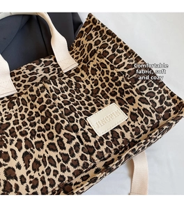 Detail of leopard print canvas tote bag featuring premium texture and durable fabric