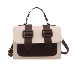 Retro contrast color crossbody bag with cream and brown leather panels and top handle