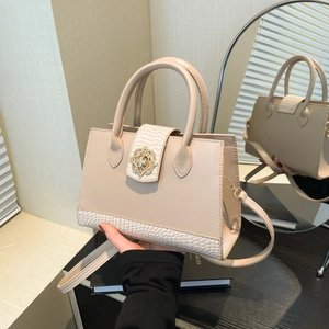 Elegant beige croc-embossed small square handbag with gold flower lock and shoulder strap