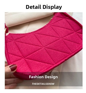 Close-up of rose red felt shoulder bag with geometric quilted pattern and gold metal chain