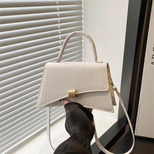 Minimalist off-white crocodile pattern underarm bag with gold metal clasp and top handle