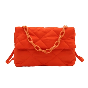 Quilted bright orange puffy shoulder bag with diamond stitching and chunky chain handle