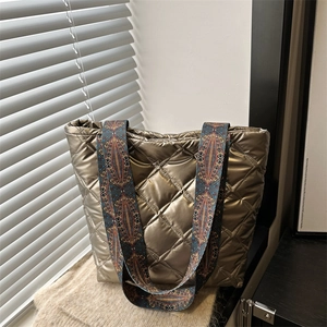 Bronze quilted tote bag with菱格 pattern and colorful ethnic woven shoulder strap
