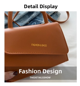 Gros plan d'un sac à main en cuir marron avec logo doré Fashion & Bags et coutures fines