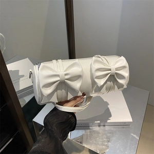 Sac bandoulière blanc cylindrique avec double nœud élégant et zip argenté
