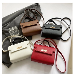 Detailed collection of mini leather handbags in brown, black, white, and red with metal locks