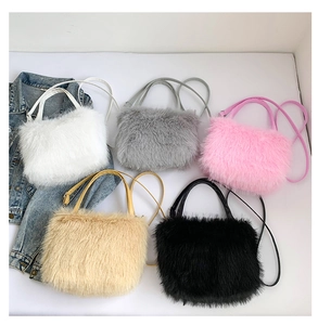 Detailed flat lay of plush faux fur handbags in white, pink, grey, khaki and black