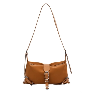 Brown faux leather baguette bag with silver hardware and vintage motorcycle style details