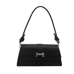 Elegant black baguette bag with faux crocodile pattern and silver metal buckle accent