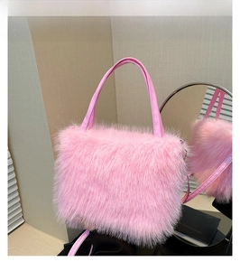 Pink faux fur handbag detail showing plush texture with matching leather handle and strap