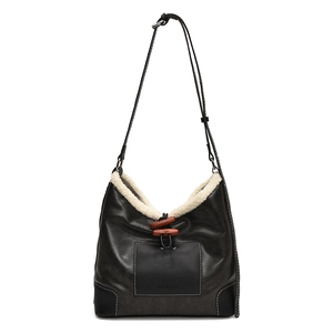 Retro grey leather bucket bag with white shearling trim and decorative horn buckles