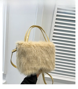 Detail of khaki faux fur crossbody bag featuring soft plush texture and adjustable strap