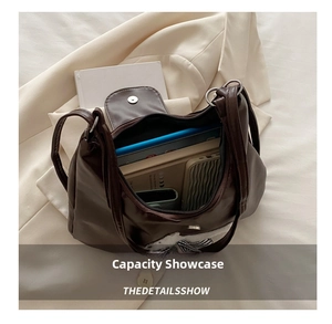 Interior view of large capacity dark brown tote bag storing a tablet and daily items