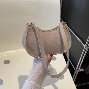 Minimalist beige felt shoulder bag with geometric quilted pattern and gold zipper closure