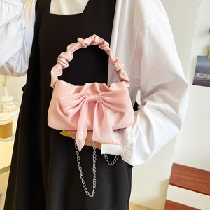 Vintage pink bow handbag with ruched handle and silver chain strap for women