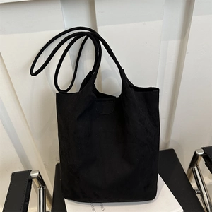 Large black suede tote bag with minimalist slim straps for commuting and daily storage